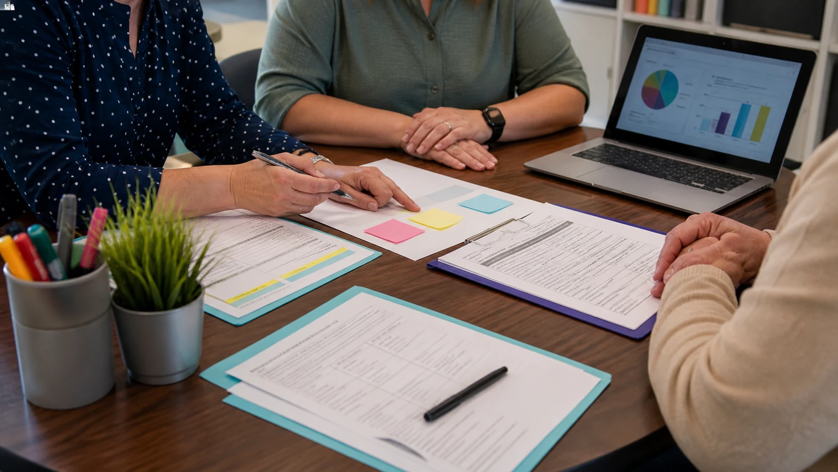 Teacher and parent comparing notes